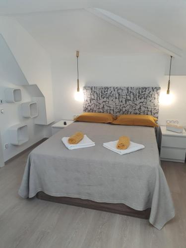 a bedroom with a bed with two towels on it at Villa Daniel Saint Aygulf in Fréjus