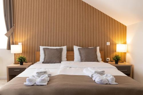 Postel nebo postele na pokoji v ubytování Zona Optimizma accommodation & SPA