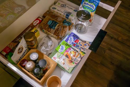 a table with food and other food items on it at LIKE HOME 2 Sauna,Jacuzzi & Spa in Świdnica