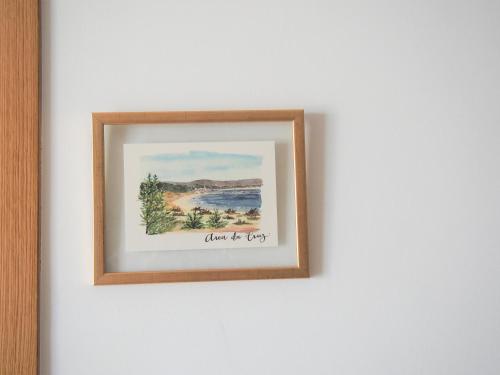 a picture of a painting on a white wall at HOTEL BOUTIQUE VILAVELLA in O Grove