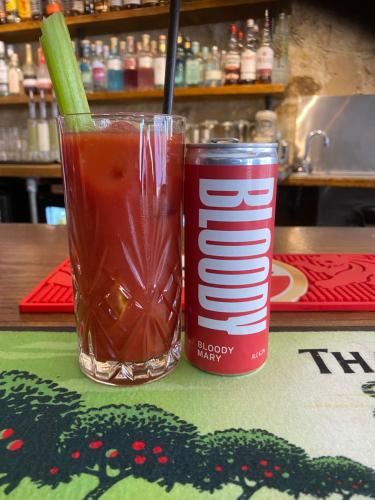 a drink and a can of soda on a table at The Bull in Battle