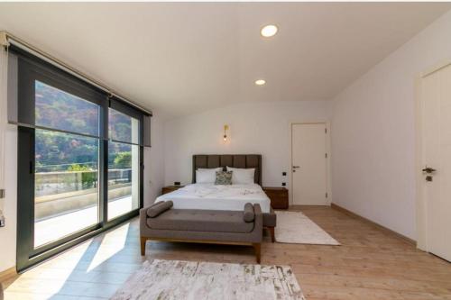 a bedroom with a bed and a large window at Villa Diamond in Marmaris