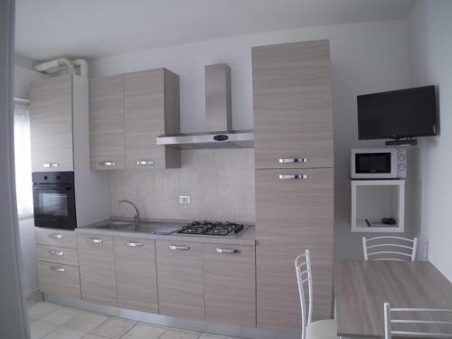 Kuchyň nebo kuchyňský kout v ubytování Condominio Belletti