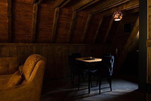 a dining room with a table and chairs at Woodland Brezna in Pluzine