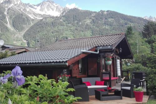 a small cabin with mountains in the background at Mazot le Petit Drus in Chamonix-Mont-Blanc