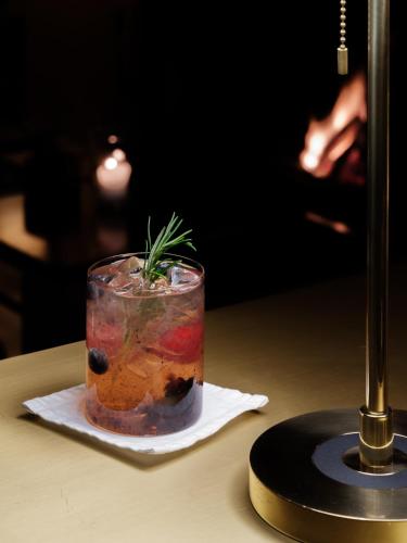 a drink on a napkin on a table at Schgaguler Hotel in Castelrotto