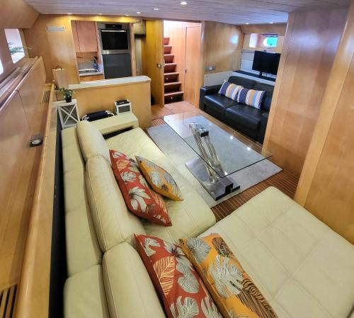 a living room with a couch and a bedroom at Hébergement Yacht in Cogolin
