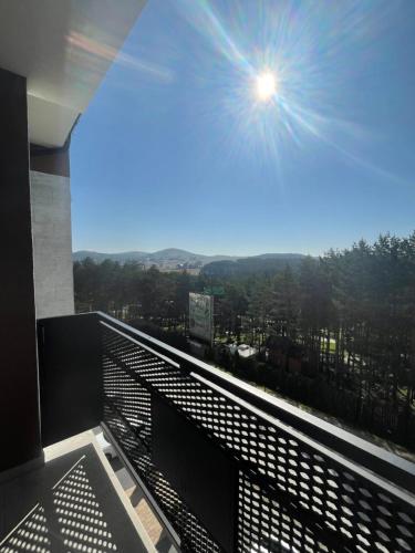 a view of the city from the balcony of a building at Apartman 21 Vila Elsa III Zlatibor in Zlatibor