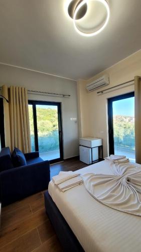 Postel nebo postele na pokoji v ubytování Sweet Home Himara