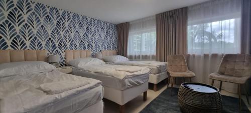 Giường trong phòng chung tại Willa Gowidlina