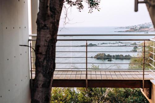 a balcony with a view of the ocean at Villa Aquamarine in Pomos