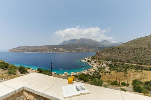 a view of a body of water from a building at Trapela Limeni Luxury Suites in Limeni