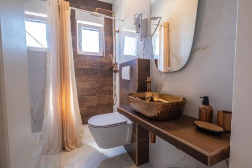 a bathroom with a sink and a toilet and a mirror at Premium Relax Rooms in Novi Vinodolski