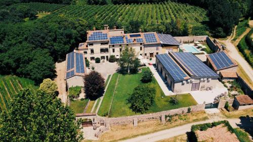 an aerial view of a house with solar panels on it at Guesthouse Corte Marzago - adults friendly in Salionze