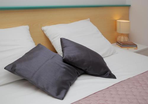 Postel nebo postele na pokoji v ubytování Apartmani Krmek