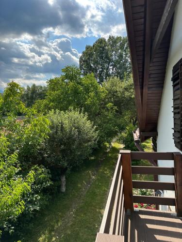 a balcony view of a garden with trees and bushes at Cristian in Dejani