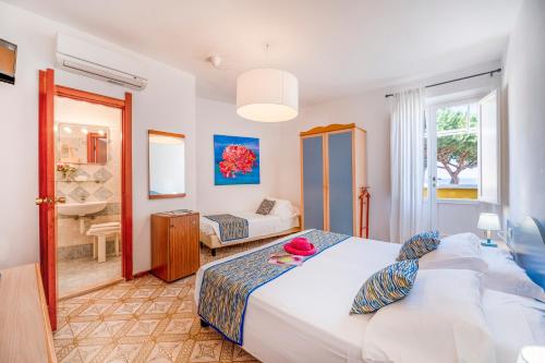 Postel nebo postele na pokoji v ubytování Hotel Rio Sul Mare