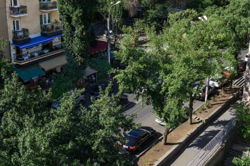 an aerial view of a street with trees and a car at Royal Plaza by Stellar Hotels, Yerevan in Yerevan