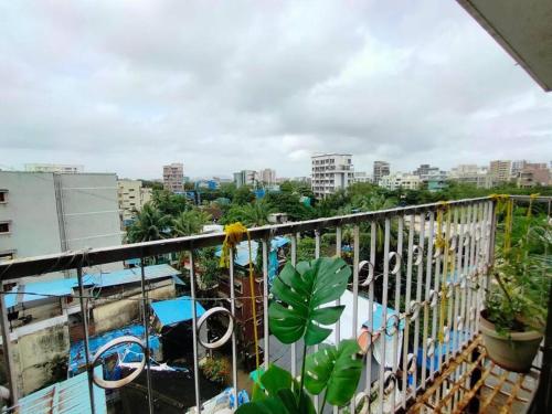 a balcony with a view of a city at 5 - Studio Velankanni Heights, Behaind Nanavati Hospital, Vile Parle by Connekt Homes in Mumbai