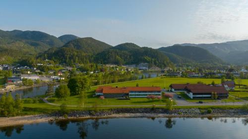 an aerial view of a town next to a river at Sirdalsvatnet Hotel in Sirdal in Tonstad
