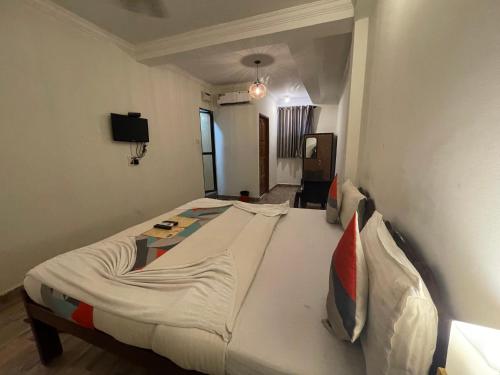 a bedroom with a large bed in a room at Baga View Inn in Baga