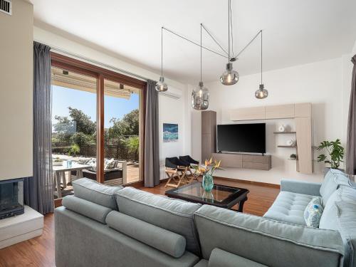 Телевизор и/или развлекательный центр в Villa Magia