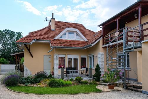a house with a red roof at 4 Évszak Apartman in Gyula