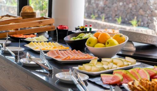 a buffet with different types of food on a table at Bakour Lanzarote Splash in Puerto del Carmen