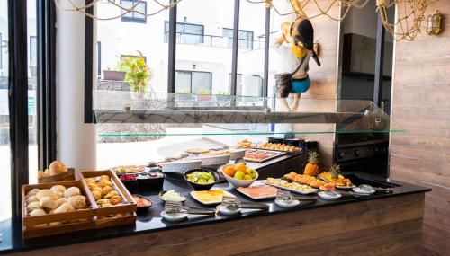 a buffet with many different types of food on display at Bakour Lanzarote Splash in Puerto del Carmen