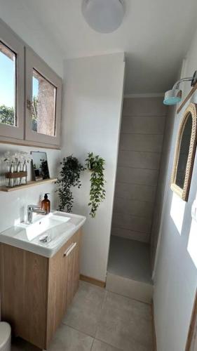 a bathroom with a sink and a stairway at Casa Ghjuvanna 2 chambres in Prunelli-di-Fiumorbo