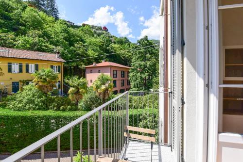 a view from the balcony of a house at Volta Central Apartment by Quokka 360 - minimal flat in Cernobbio in Cernobbio