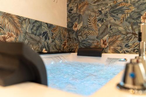a bathroom with a sink with a water fountain at Suites Matteotti 57 in Civitavecchia