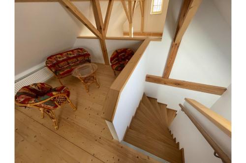 an overhead view of a room with a chair and a table at Apartmán Borovanské baroko in Borovany