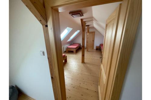 a hallway in a house with a skylight at Apartmán Borovanské baroko in Borovany