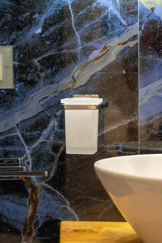 a bathroom with a white toilet and a sink at Suites Matteotti 57 in Civitavecchia