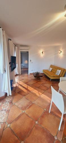 a large room with a bed and a tiled floor at La Perla de Torrenueva in La Cala de Mijas