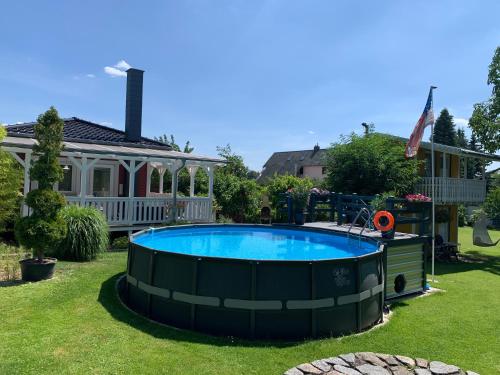 a large pool in the yard of a house at Haus-Elbromantik-Sandau in Sandau