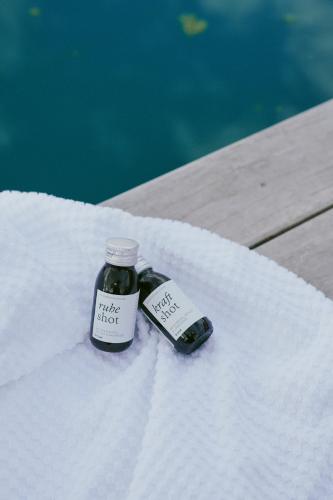 a jar of pickle shoot sitting on a white towel at SOULSISTERS' Hotel 4 Sterne Superior in Kaprun