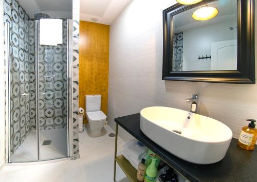 a bathroom with a sink and a shower at GALIANA CERVANTES 5 COLLECTION in Toledo