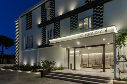 a rendering of a modern hotel at night at Hangar Hotel in Teverola