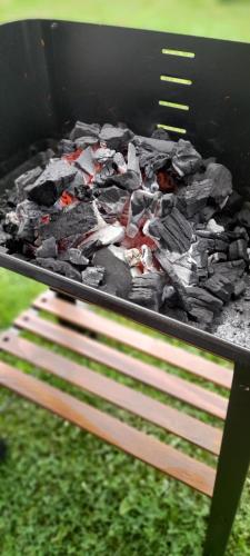a grill with a bunch of food on it at LA CASA 44, con Spa opcional in Sariego