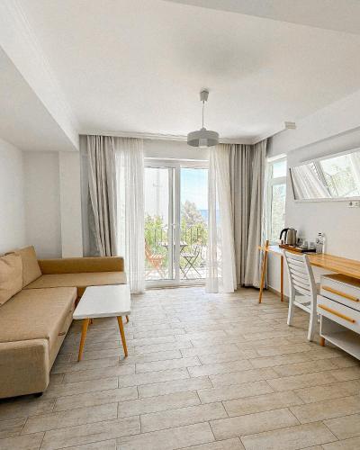 a living room with a couch and a table at Hideaway in Kas