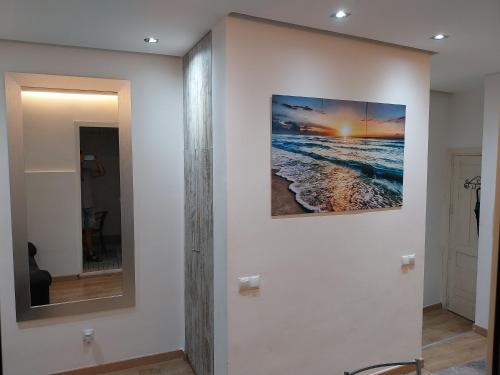 a wall with two pictures of the ocean on it at Céntrico apartamento con patio in Madrid