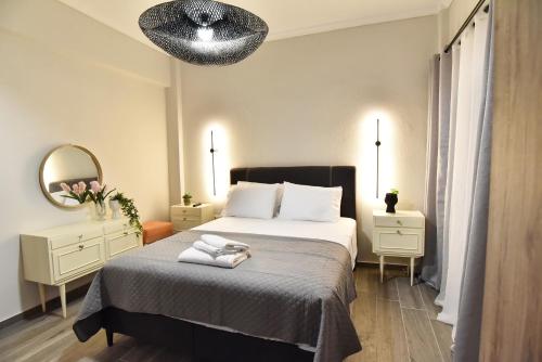 a hotel room with a bed and a mirror at Comfort Spot 1 in Kavala