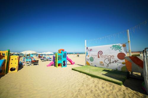 a play area on the beach with a playground at Hotel Prestige in Montesilvano