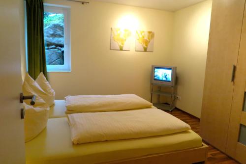 Кровать или кровати в номере Alpina Central