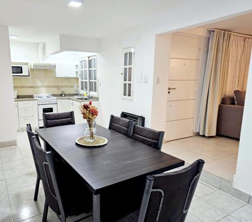 a kitchen and dining room with a table and chairs at Casa en Salta in Salta