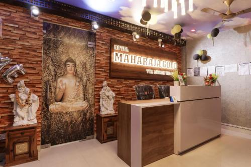 a restaurant with a brick wall with a sign on it at Flagship Hotel Maharaja Gold in New Delhi