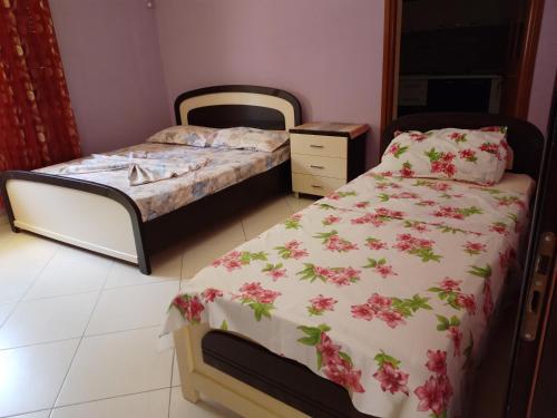 Postel nebo postele na pokoji v ubytování PARADISE VILLA