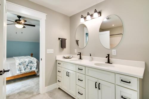 a bathroom with a sink and a mirror at Christys Cottage with Hot Tub - 2 Mi to Beach! in Snow Hill